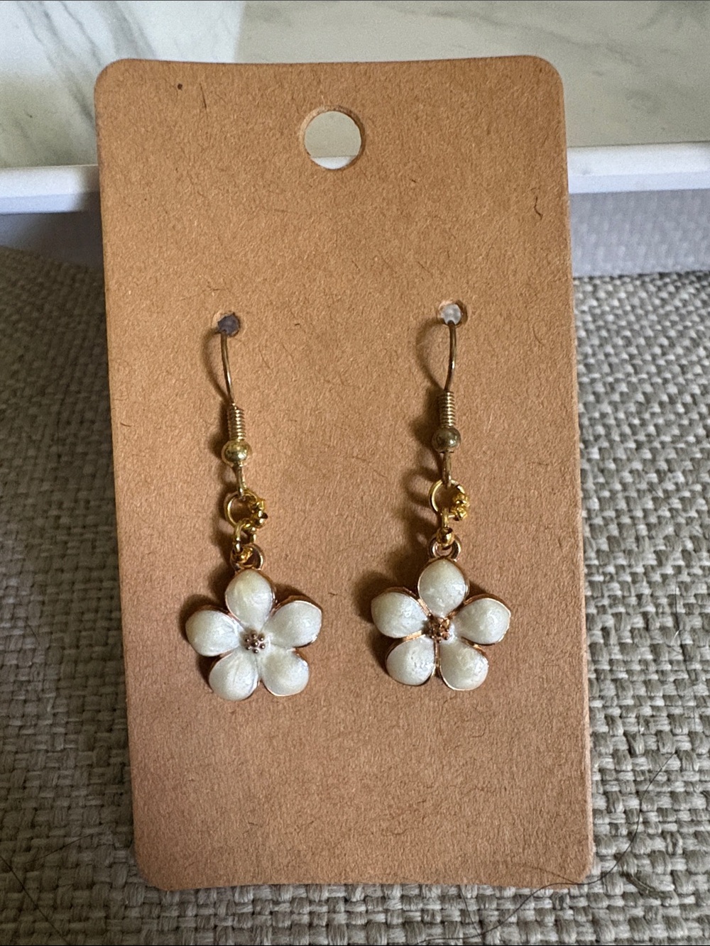 Delicate White Floral Drop Earrings with Gold Accents